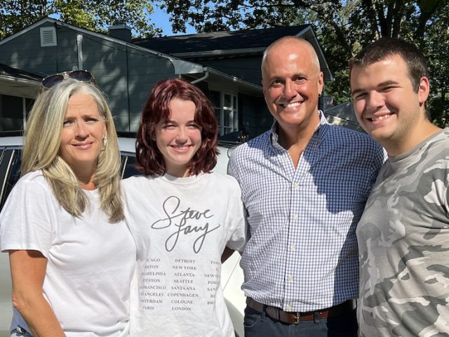 Kim stands with her family on Connor's move in day.