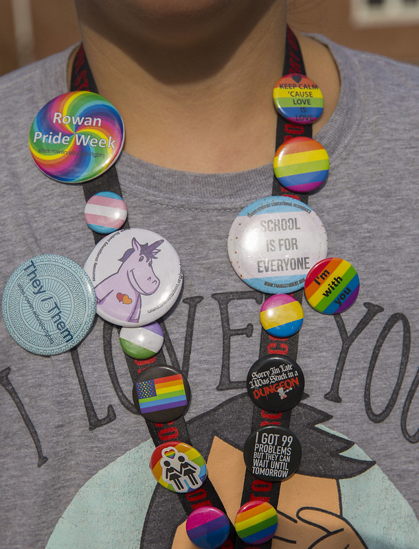 A student decked out in pins for Pride Week!