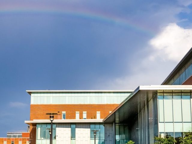 A rainbow in the sky over Business Hall.