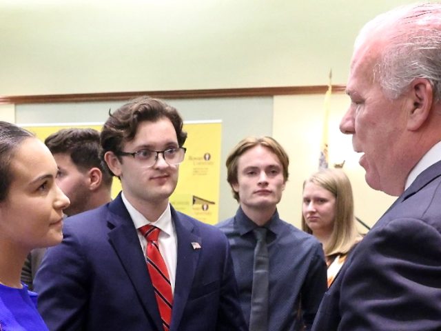 Students ask Steve Sweeny questions after events.