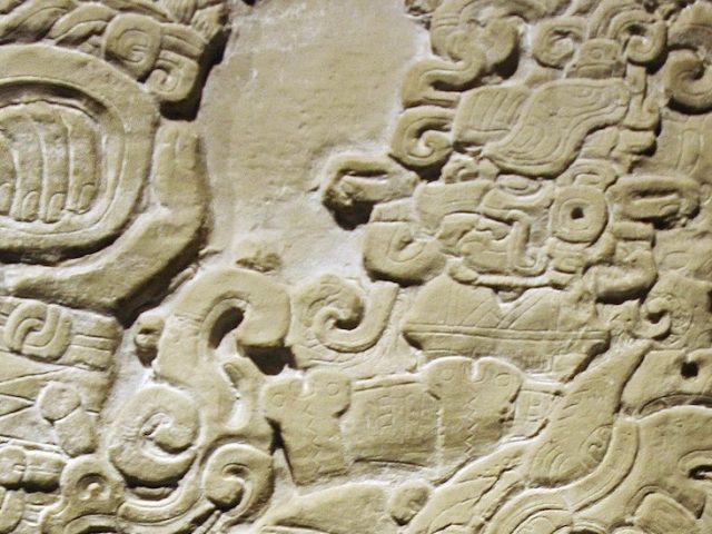 A close up of Mexican communication on a stone from an ancient civilization.