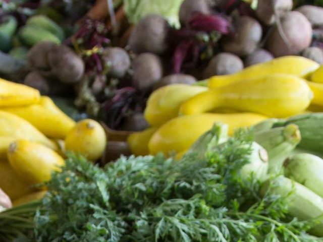 A stock image from Pexels showing a close up of a variety of densely packed fruits and vegetables.