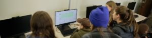 Students with a computer.