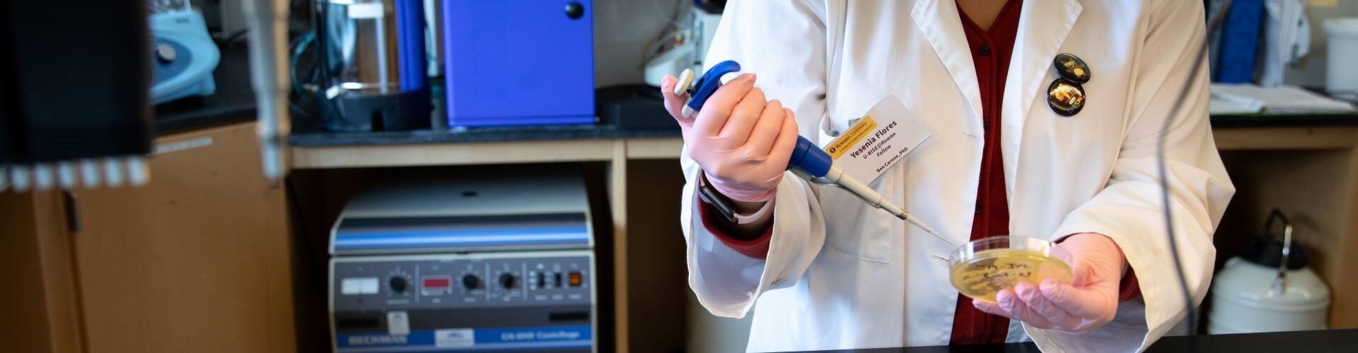 A close up of hands working in a lab, belonging to Rowan University biological sciences major Brian Libby.