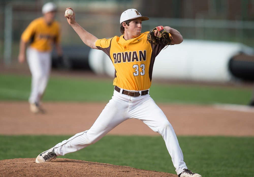 Richie, wearing #33 Rowan baseball uniform, is captured mid-pitch. 