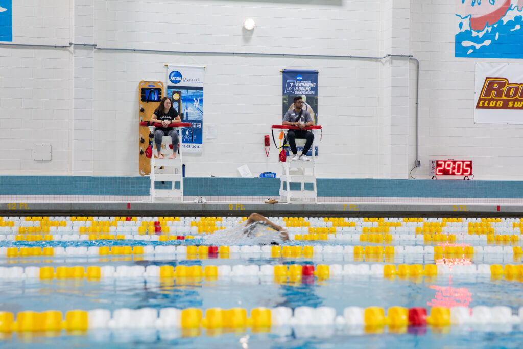 Swimming facility inside of the Rowan Recreational Center with one swimmer swimming in a lane.