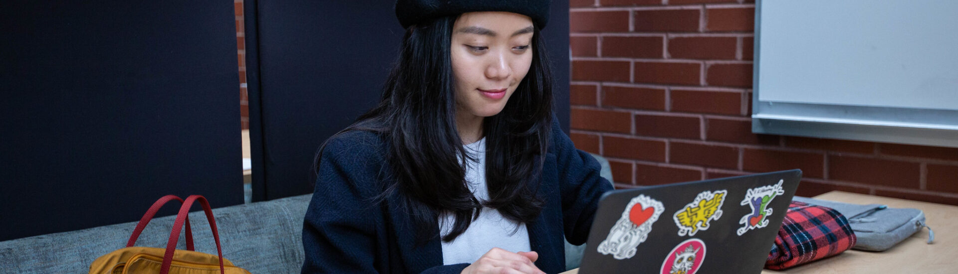 Student studying for an online criminal justice degree, working independently on coursework.