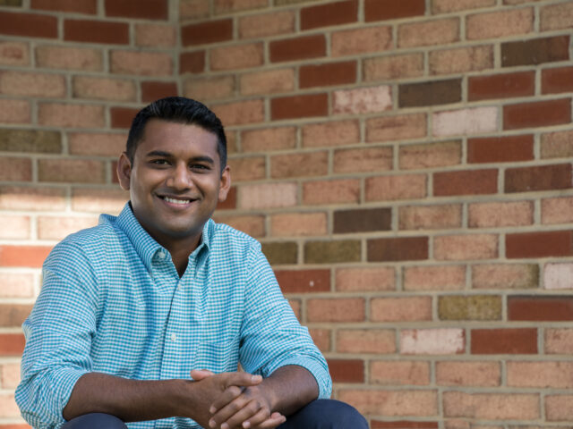 Smiling student representing success in an online psychology degree program