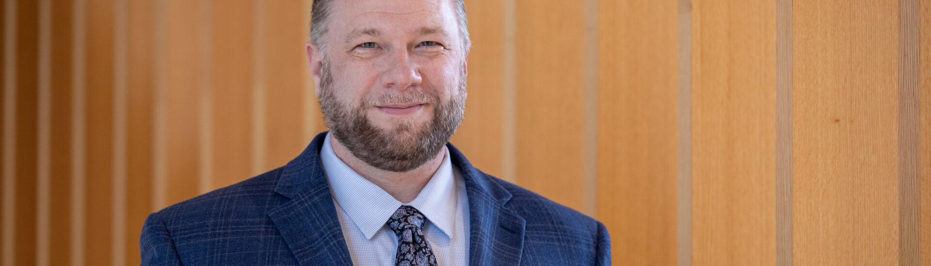 Confident school leader in a suit – how to become a principal.