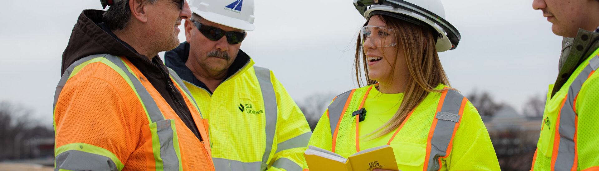 Students gaining hands-on experience in an online construction management degree program.