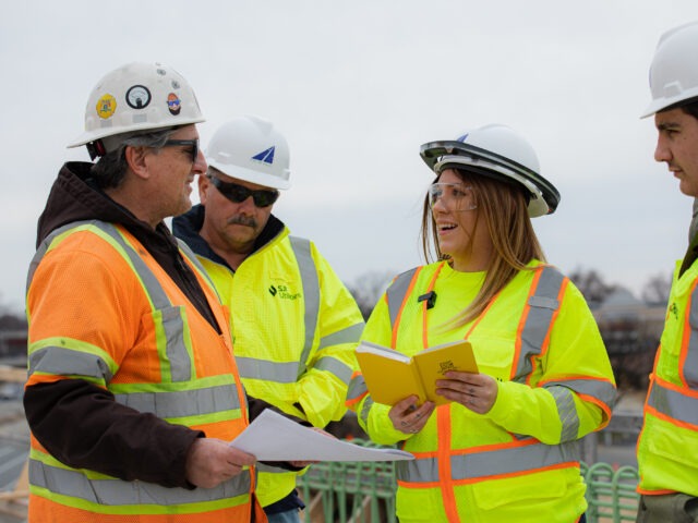 Students gaining hands-on experience in an online construction management degree program