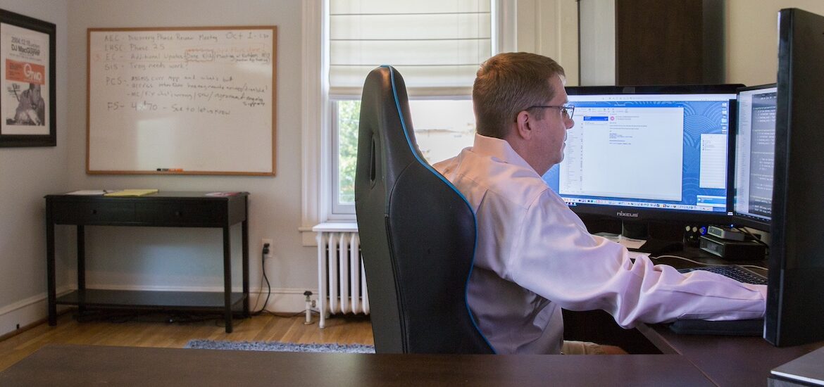 A Rowan University graduate who works in Information Technology works in his spacious home office.