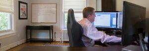 A Rowan University graduate who works in Information Technology works in his spacious home office.