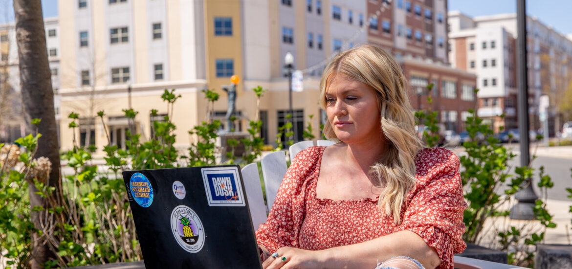 Student earning an online computer technology degree in a flexible learning space