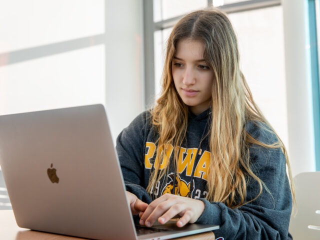 Student studying online for a construction management degree, highlighting flexible learning