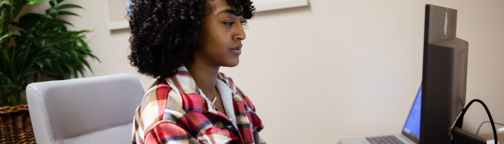 Student earning a master’s in health and wellness online, studying independently with flexible online coursework