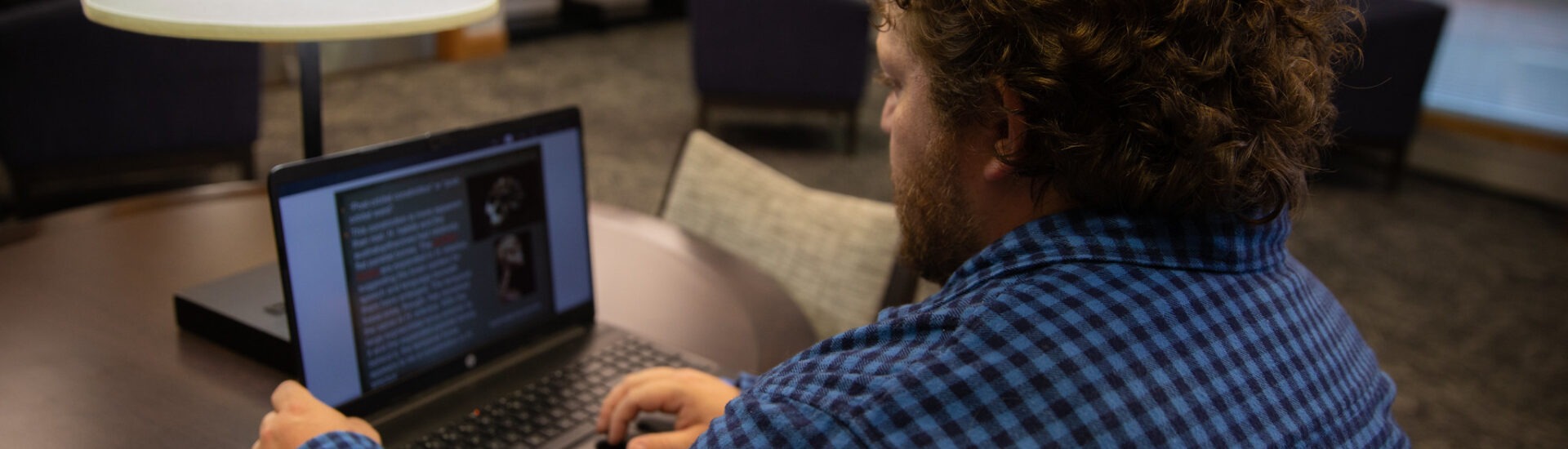 Student doing coursework for his online liberal arts degree.
