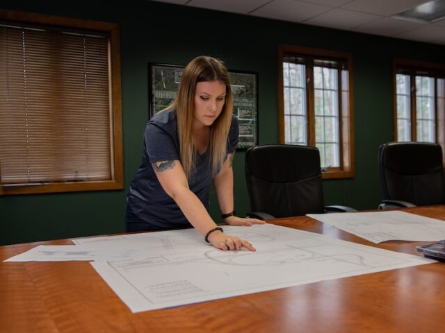 A construction management graduate studies blueprints.