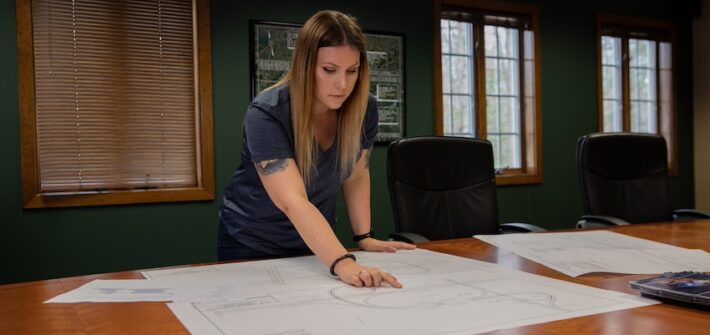 A construction management graduate studies blueprints.