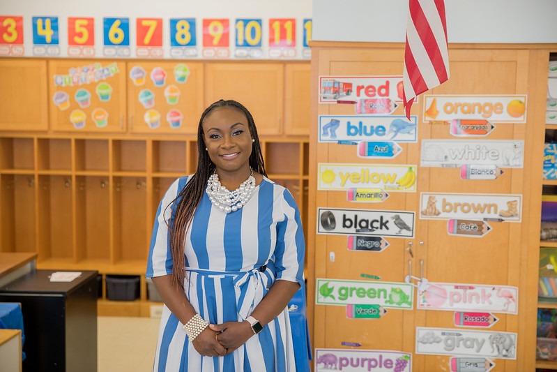 Rowan special education master's student stands in her classroom, hands clasped in front of her.