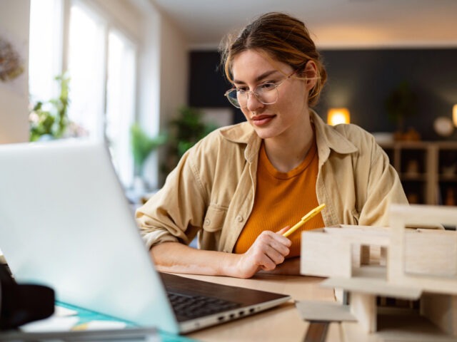 Prospective grad student googling "masters in engineering management vs mba" on computer.