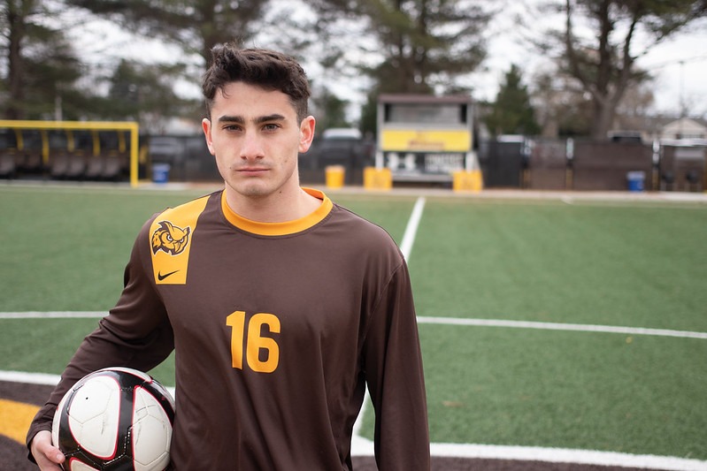 Galway United Shane Doherty as a college senior at Rowan University, standing on the soccer field holding a soccer ball wearing his #16 uniform.