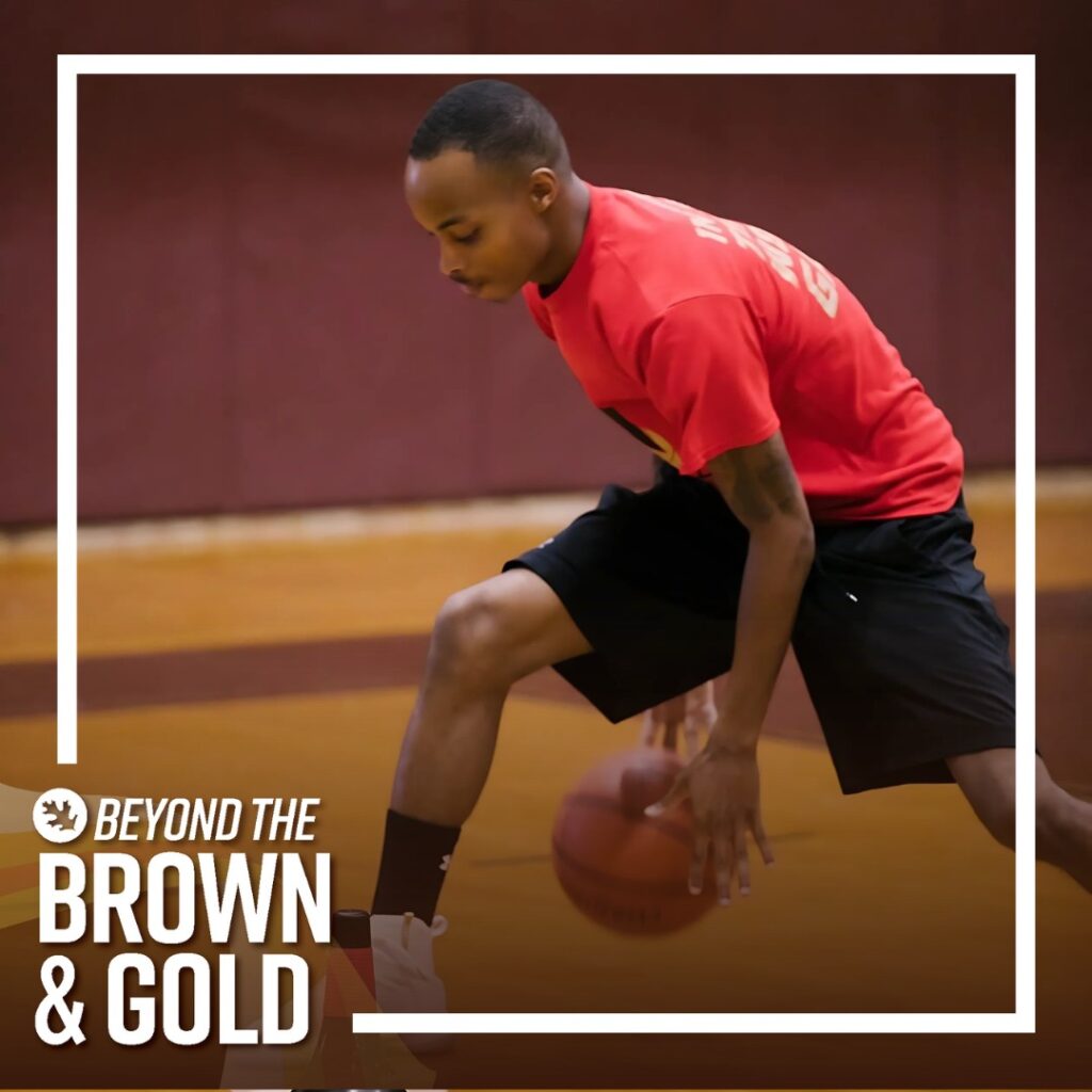 Devón Coles dribbles a basketball under his legs, with the frame of the image saying Beyond the Brown & Gold. 