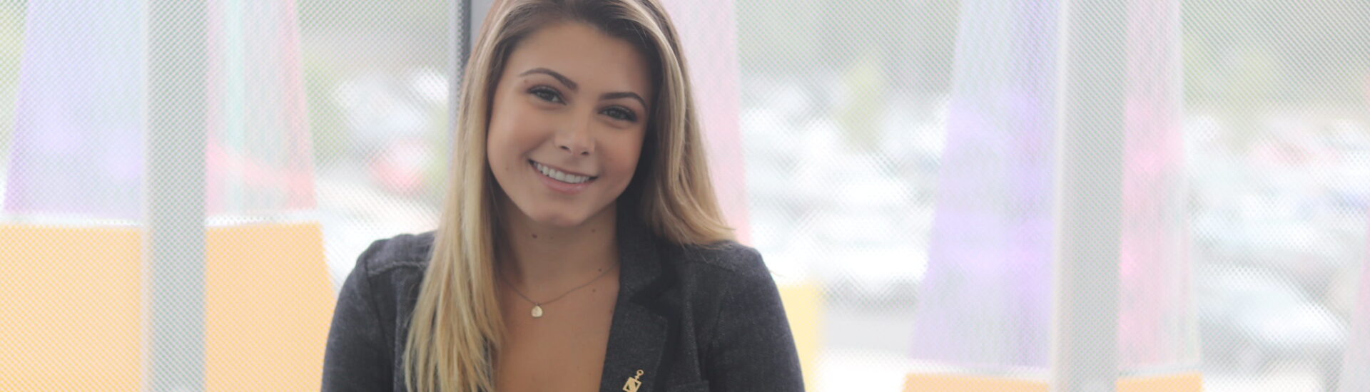 Smiling graduate student preparing for leadership roles through an MBA program with specialized concentrations.