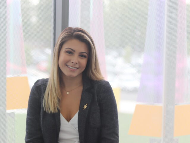 Smiling graduate student preparing for leadership roles through an MBA program with specialized concentrations.