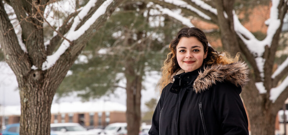 Student on Rowan University campus in winter.