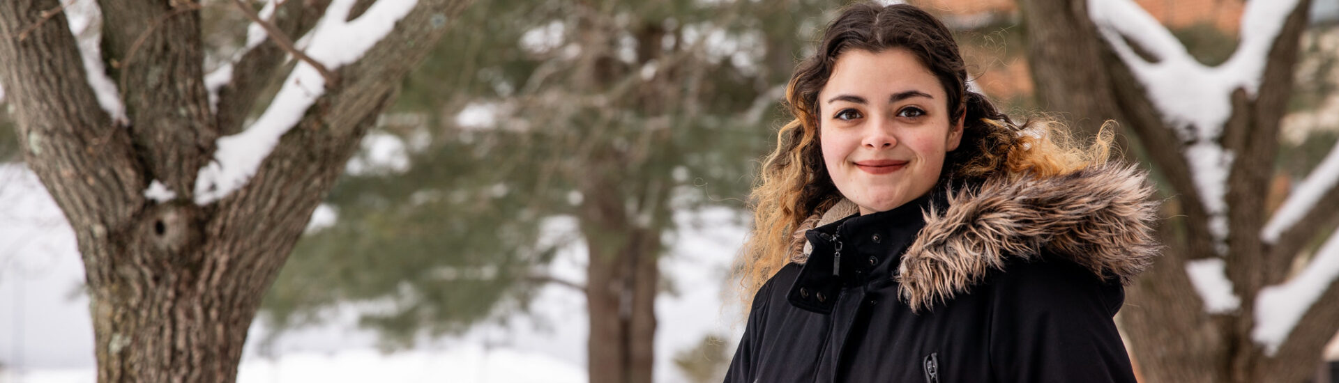 Student on Rowan University campus in winter.