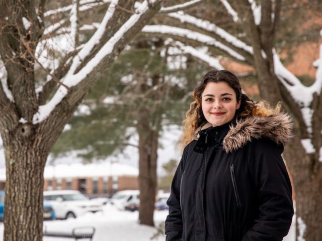 Student on Rowan University campus in winter.