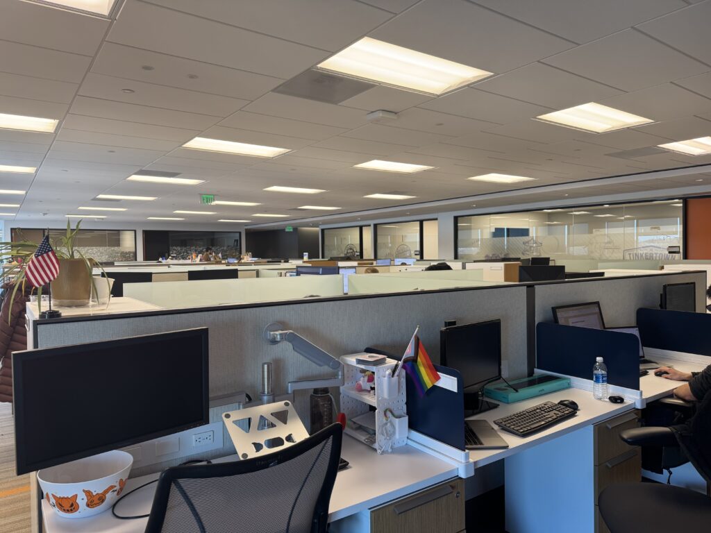 A Rowan information systems & analytics intern provided photo of an overview photo of the large floor plan of cubicles and desks at Subaru of America headquarters.  