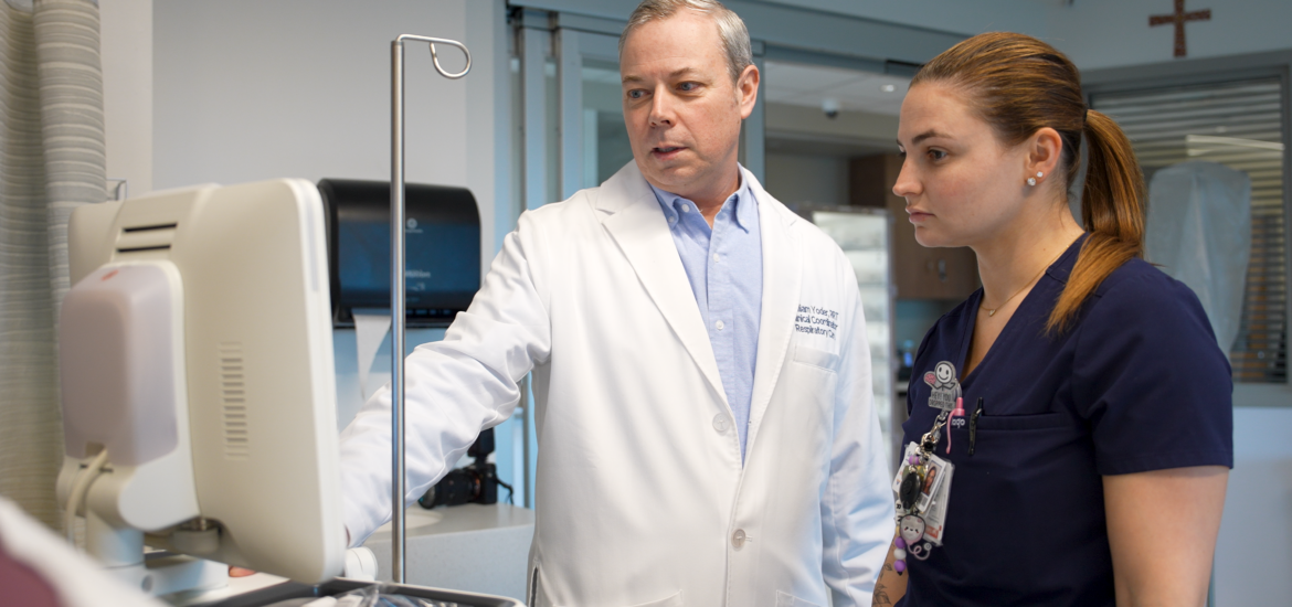 William Y., Clinical Coordinator at Virtua Health, mentoring a team member he oversees in the hospital setting.