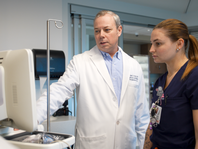 William Y., Clinical Coordinator at Virtua Health, mentoring a team member he oversees in the hospital setting.