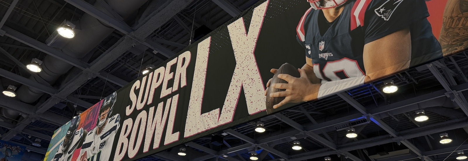 The convention center signage above guests' heads at Media Row ahead of the Super Bowl, froma Rowan sports communication and media student's perspective.