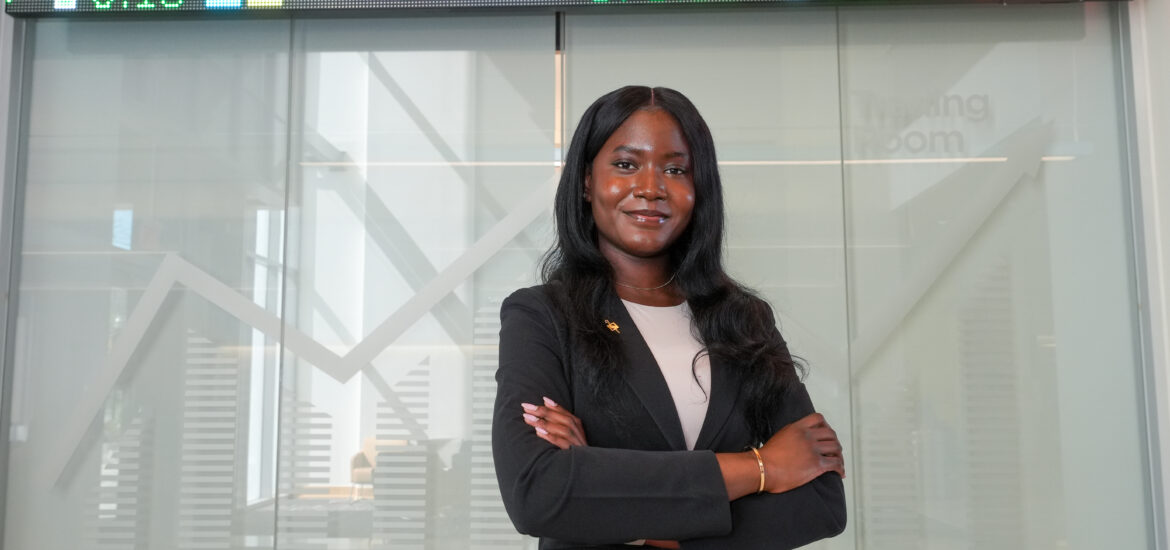 Taiwo, a finance major, poses for a photo at Business Hall.