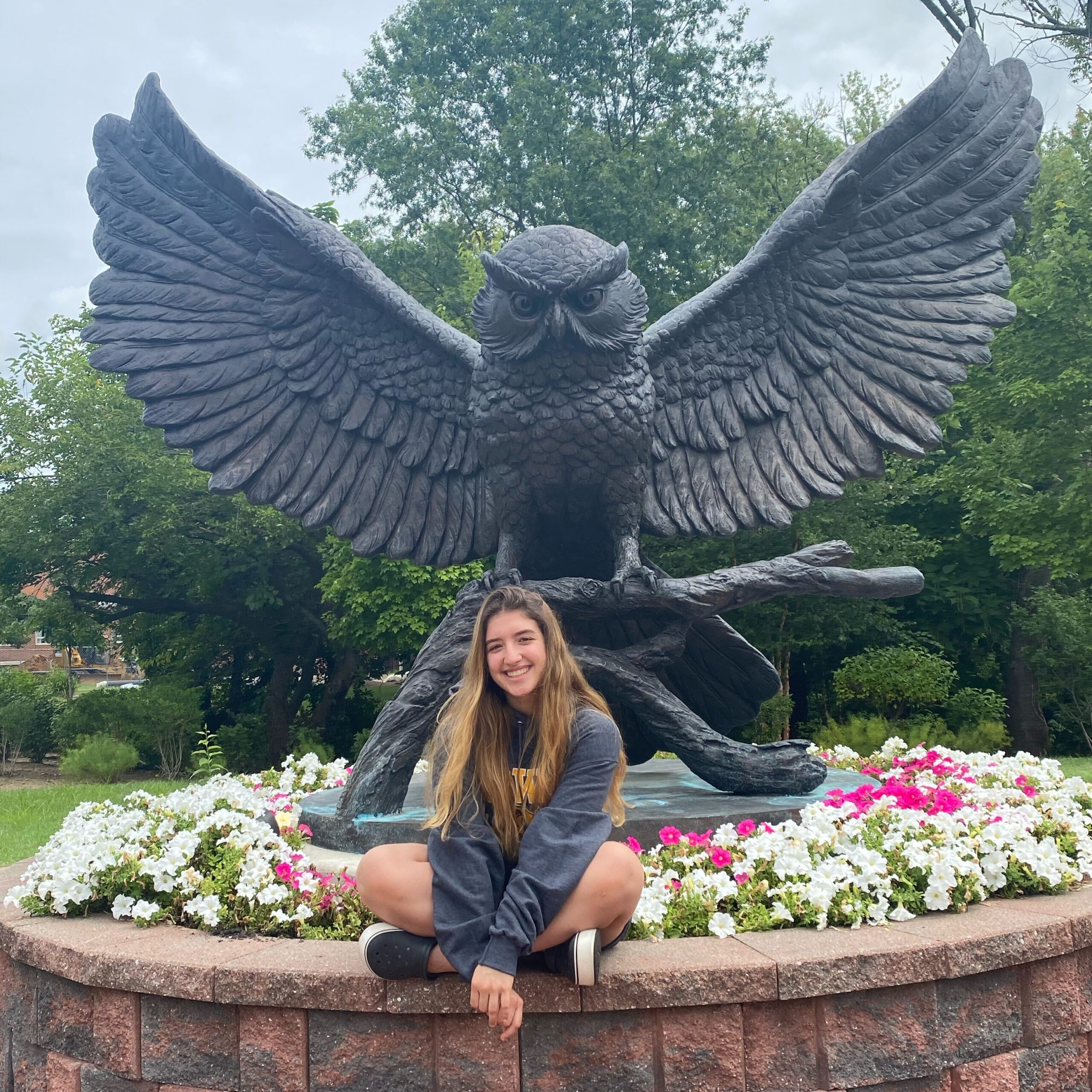 Valentina poses in front of the Prof statue.