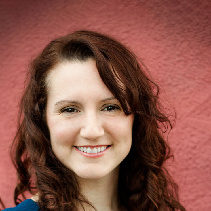 Melissa T. smiles for a portrait.